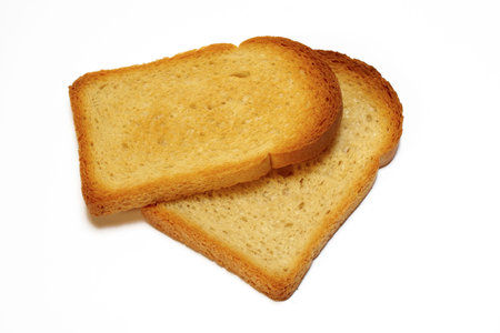 Two slices of toasted bread isolated on white background