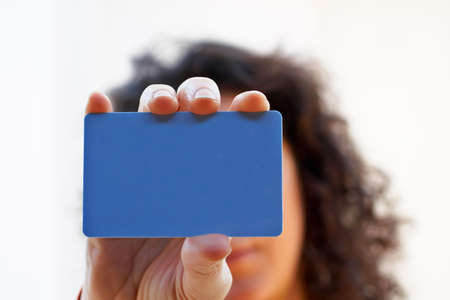 Woman with a credit card on her handの写真素材