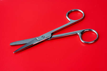 scissors on a red backgroundの写真素材