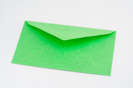 Green envelope isolated on white backgroundの写真素材