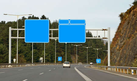 Road signs over the cloudy autumn skyの写真素材