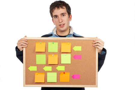 Teenager holding the corkboard with notes on white background