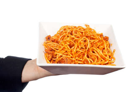 Showing a freshly cooked plate of spaghetti bologneseの写真素材