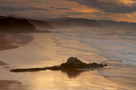 The golden sunrise in the spanish coastlineの写真素材