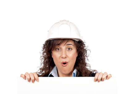 Surprised female architect behind the white cardの写真素材