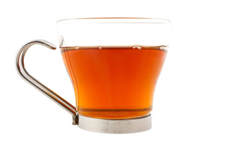 A glass cup of tea with one slice of lemon isolated, with clipping path. Shallow dofの写真素材