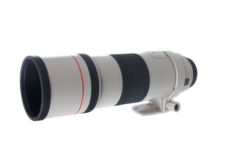 Camera telephoto lens reflected on the white background