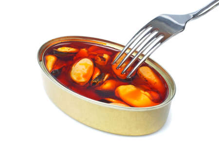 The fork above the mussels canned with soft shadow on white backgroundの写真素材