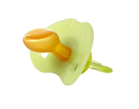 A green pacifier isolated on white background