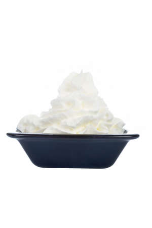 Fresh cream in a black dish, isolated on white backgroundの写真素材