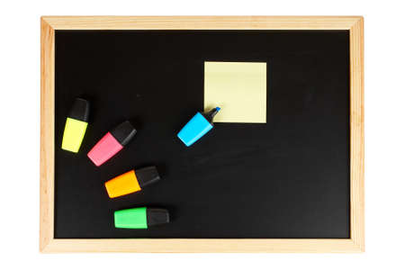 A empty black chalkboard with coloured labellers and yellow note. Path includedの写真素材