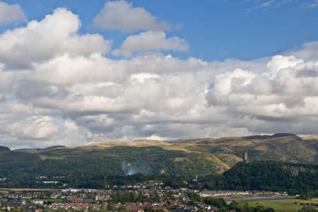 A view of Stirling and National Wallace Monument under a cloudy sky, Scotlandの写真素材