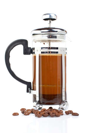 A coffee pot with beans, reflected on white backgroundの写真素材