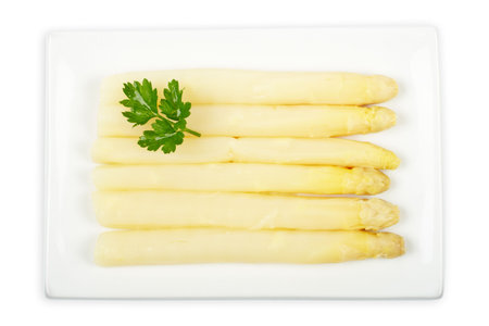 Asparagus in the white plate with soft shadow Shallow depth of fileの写真素材
