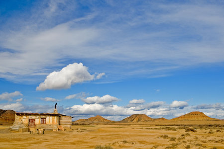 Old shanty under the cloudy sky in spring seasonの写真素材