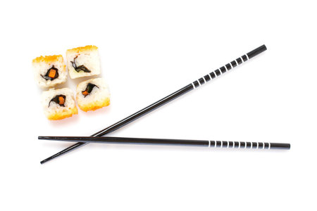 Sushi and chopsticks on white background. Shallow depth of fieldの写真素材