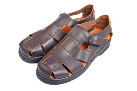 Brown leather sandals isolated on white background. Shallow depth of fieldの写真素材