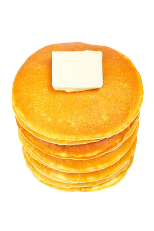 A big stack of pancakes with butter isolated on white background. Shallow depth of fieldの写真素材