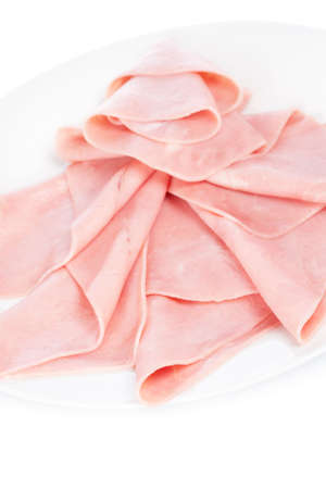 Slices of tasty ham on white dish. Shallow depth of fieldの写真素材