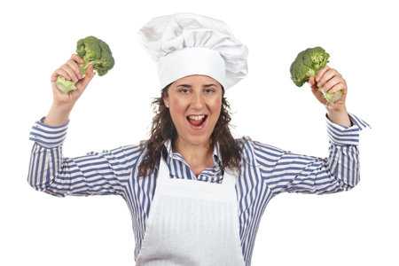 Cook woman holding two broccolis isolated on white background