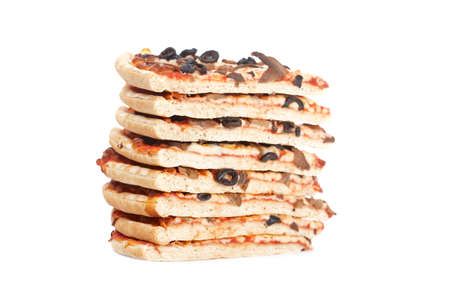 Slices of tasty Italian pizza stacked, isolated on white background. Shallow depth of fieldの写真素材