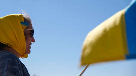 Woman with yellow scarf at Ukraine rallyのeditorial素材