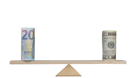 Parity in value of Euro and US Dollar equally balanced on a scaleの写真素材