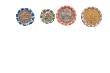 Photo of rolled US coins nickels, dimes, quarters, dollars placed on end on white backgroundの写真素材