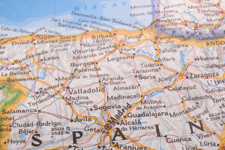 Close up detail of a colorful map highlighting Madrid, Spain through selective focus, background blurの写真素材