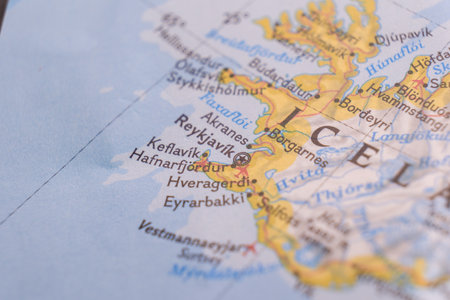 Close up of a colorful map focusing on Reykjavik, Iceland through selective focus, background blurの写真素材
