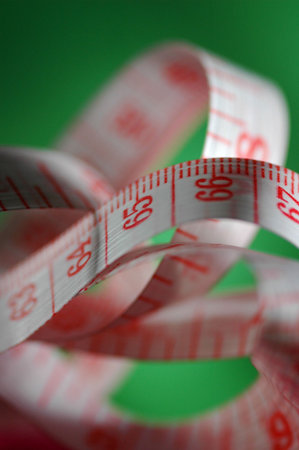 measure tape with green backgroundの写真素材