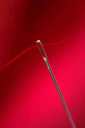 close up needle with red backgroundの写真素材