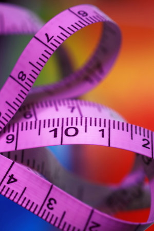 Swirling tape measure on white backgroundの写真素材