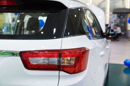 Handshake of two businessmen when selling a car in a motor show, close-upのeditorial素材