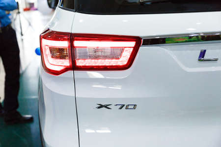 Handshake of two businessmen when selling a car in a motor show, close-upのeditorial素材