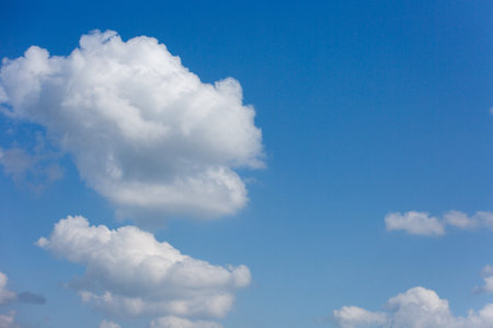 Beautiful and thick clouds in the blue sky. Cloudy sky on a clear day