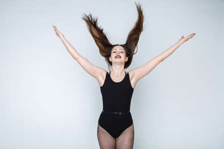 Young and beautiful girl posing in pantyhose mesh. Dancer strip dance.の写真素材