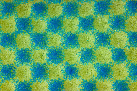 Texture of yellow and blue foam with a square in a staggered orderの写真素材