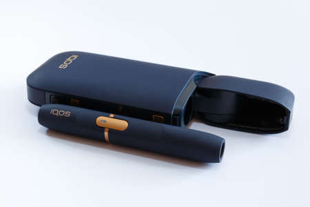 Novokuznetsk, Russia 21.02.2020 year. IQOS set for Smoking small cigarettes on a white background. Isolate. Editorialのeditorial素材