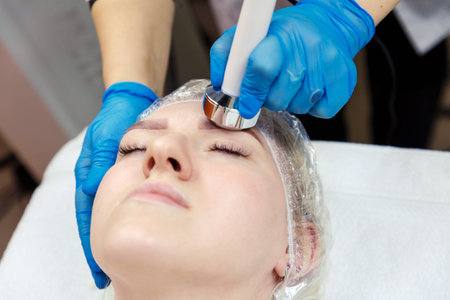 Correction of the shape of the face cavitation in the cosmetology room.