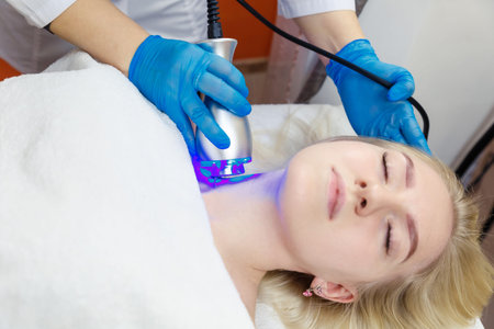 Facial skin care in the beauty parlor using cryo care. Hardware cosmetology in the spa salon.