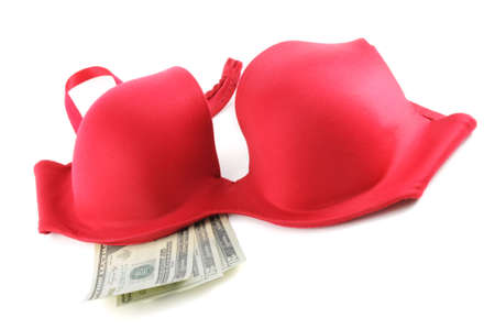 A red bra with 3, $20 (twenty dollar) bills isolated on a white background in studio.の写真素材