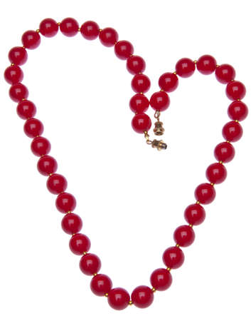 Heart shaped necklace of fake red pearls.  Isolated on white with a clipping path.の写真素材
