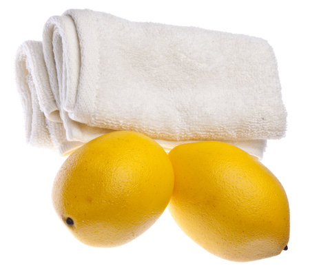 Fresh lemons are at the center of this spa related image.の写真素材