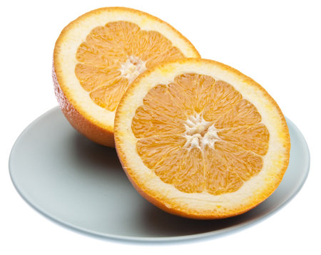 Sliced orange on a blue plateの写真素材