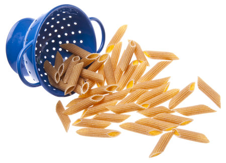 Whole Wheat Pasta in a Vibrant Blue Colanderの写真素材