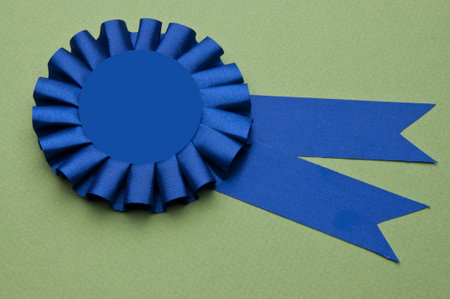 First Place Prize Ribbon on a Green Background for Environmental Themed Images.の写真素材