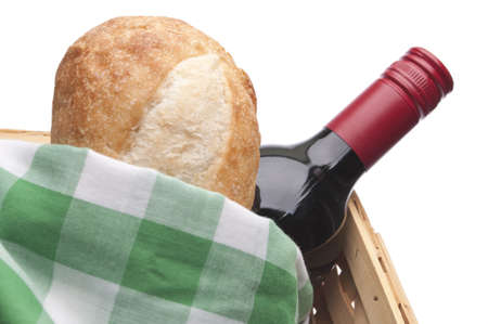 Summer Picnic Scene with Bread, Red Wine and a Picnic Basket.  Isolated on White の写真素材