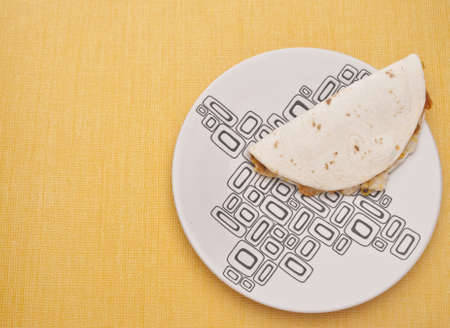 Quesadilla on a Plate with Vibrant Yellow Copy Space.の写真素材