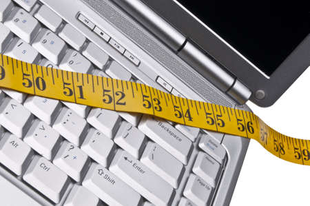 Conceptual Image with Laptop and Measuring Tape.の写真素材